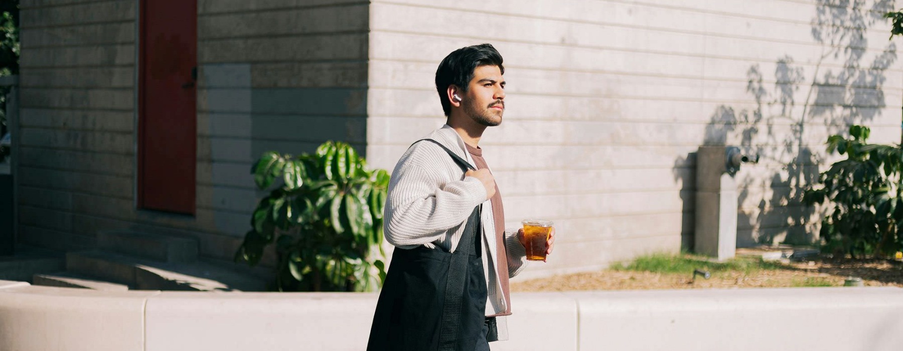 a man holding a drink